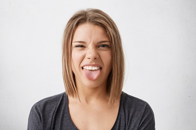 a woman sticking out her tongue