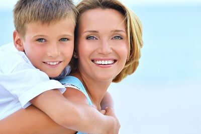 a mother and son smiling
