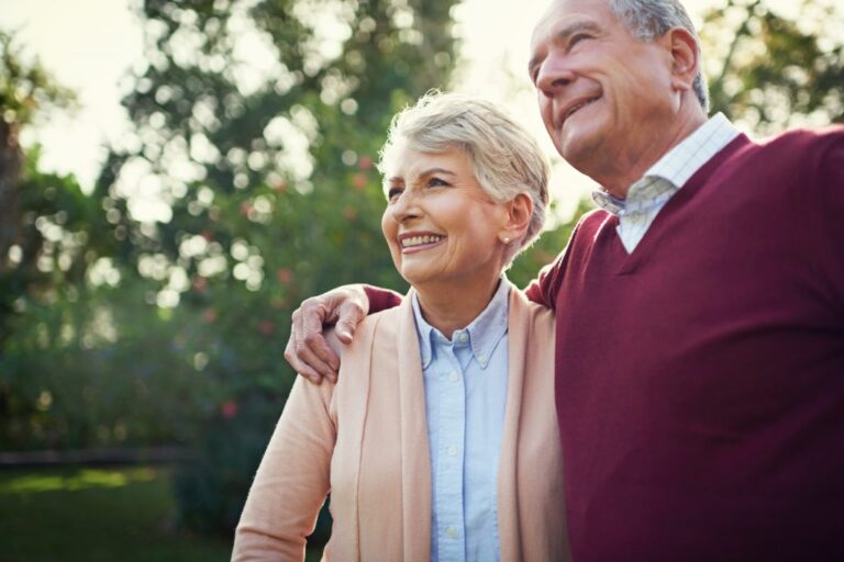 an older couple walking together