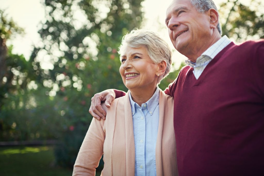 an older couple walking together
