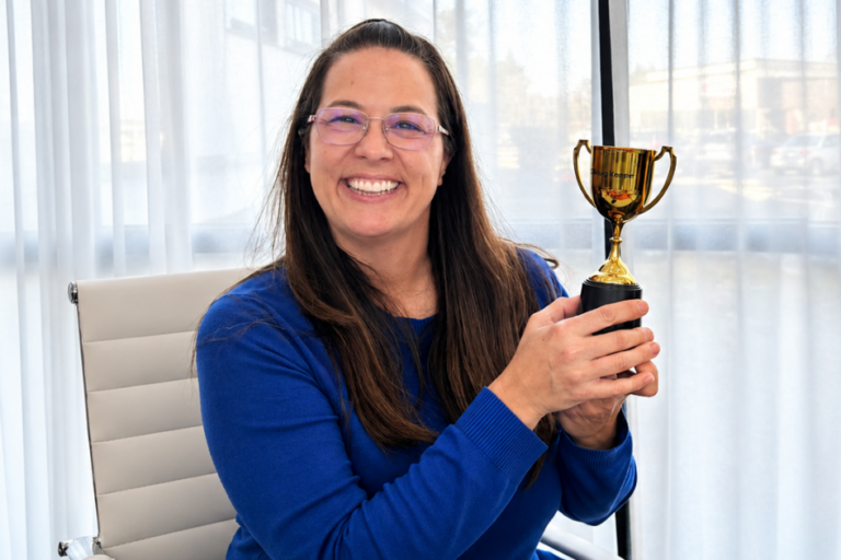 female holding trophy