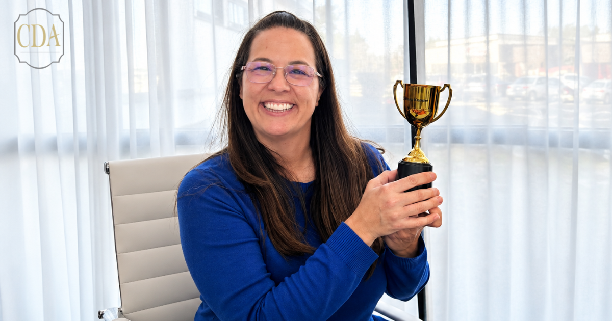 female holding trophy